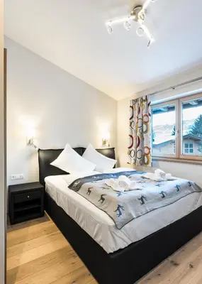 Ein Bett oder Betten in einem Zimmer der Unterkunft Center Penthouse Hollersbach Top 10 by Alpina-Holiday