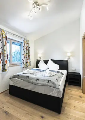 Ein Bett oder Betten in einem Zimmer der Unterkunft Center Penthouse Hollersbach Top 10 by Alpina-Holiday