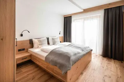 Ein Bett oder Betten in einem Zimmer der Unterkunft Hohe Tauern Lofts Panoramabahn by Alpina-Holiday
