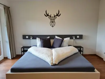 Ein Bett oder Betten in einem Zimmer der Unterkunft Ferienwohnung Zauberwinkelweg mit Traum-Aussicht!