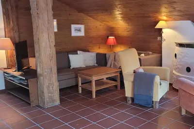 Ein Sitzbereich in der Unterkunft City Apartment Hornblick