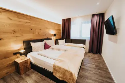 Ein Bett oder Betten in einem Zimmer der Unterkunft ApartKlusiv Kaltenbach