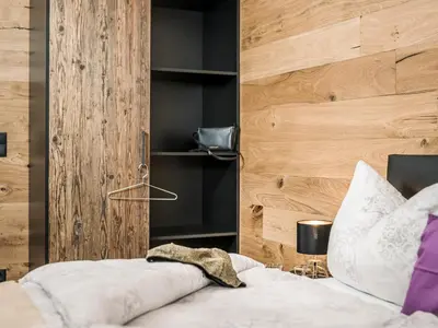Ein Bett oder Betten in einem Zimmer der Unterkunft ApartKlusiv Kaltenbach
