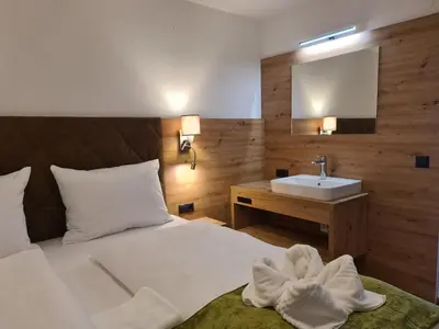 Ein Bett oder Betten in einem Zimmer der Unterkunft Hotel Alpenhof***