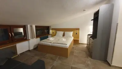 Ein Bett oder Betten in einem Zimmer der Unterkunft Absolute Active Roulette Apartments Kirchberg