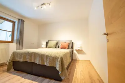Ein Bett oder Betten in einem Zimmer der Unterkunft Ferienwohnung am Wald