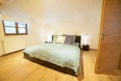 Ein Bett oder Betten in einem Zimmer der Unterkunft Ferienwohnung am Wald