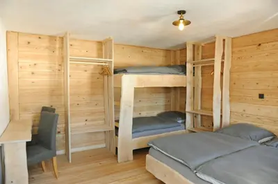 Ein Bett oder Betten in einem Zimmer der Unterkunft Ferienhof Holzmeister
