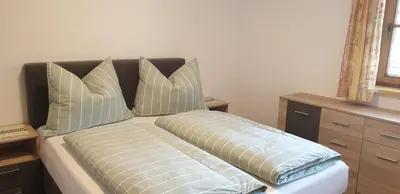 Ein Bett oder Betten in einem Zimmer der Unterkunft Ferienwohnung Sappl