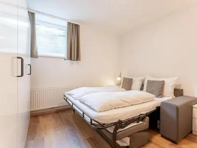 Ein Bett oder Betten in einem Zimmer der Unterkunft Heimelig XL