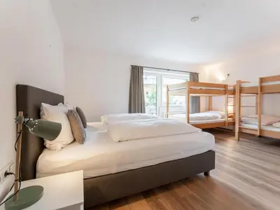 Ein Bett oder Betten in einem Zimmer der Unterkunft Heimelig L