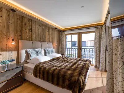 Ein Bett oder Betten in einem Zimmer der Unterkunft Bergliebe by Apartment Managers
