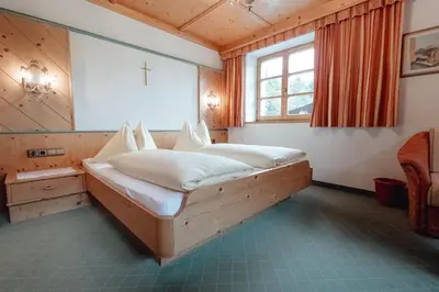 Ein Bett oder Betten in einem Zimmer der Unterkunft Zimmer & Ferienwohnungen Dandler