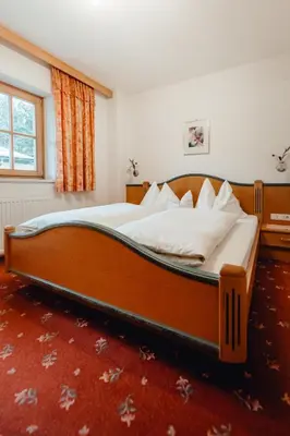 Ein Bett oder Betten in einem Zimmer der Unterkunft Zimmer & Ferienwohnungen Dandler