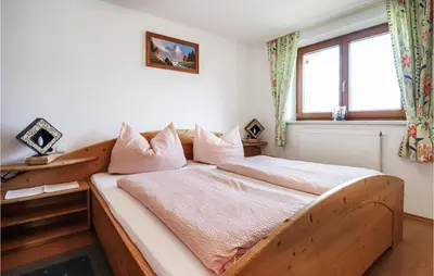Ein Bett oder Betten in einem Zimmer der Unterkunft Moderne Ferienwohnung Uderns