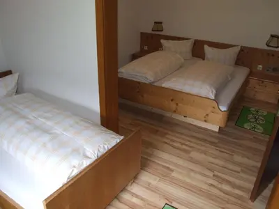 Ein Bett oder Betten in einem Zimmer der Unterkunft Gasthof Hauserwirt