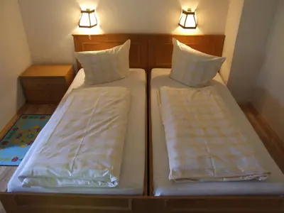 Ein Bett oder Betten in einem Zimmer der Unterkunft Gasthof Hauserwirt