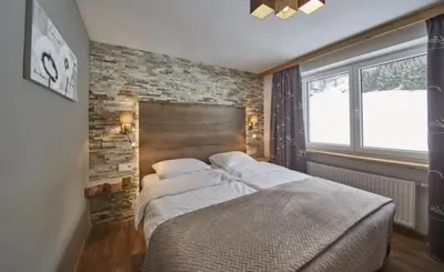 Ein Bett oder Betten in einem Zimmer der Unterkunft Saalbacher Perle Top 3 - JOKERCARD INCLUDED IN SUMMER