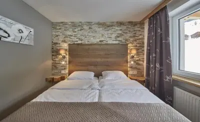 Ein Bett oder Betten in einem Zimmer der Unterkunft Saalbacher Perle Top 3 - JOKERCARD INCLUDED IN SUMMER
