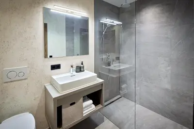 Ein Badezimmer in der Unterkunft Alpin Residenzen Buchensteinwand St. Ulrich by Alpina-Holiday