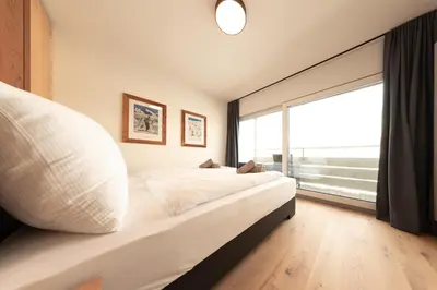 Ein Bett oder Betten in einem Zimmer der Unterkunft Apartment Alpenblick