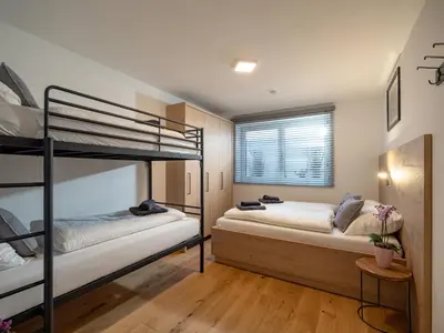 Ein Bett oder Betten in einem Zimmer der Unterkunft Residenz Brixental Top 2