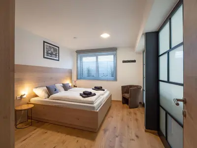 Ein Bett oder Betten in einem Zimmer der Unterkunft Residenz Brixental Top 2