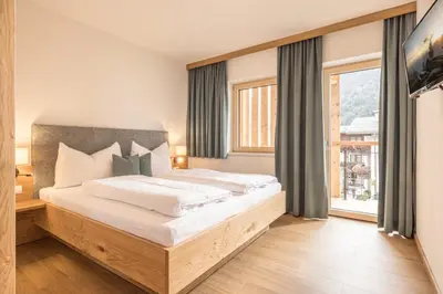Ein Bett oder Betten in einem Zimmer der Unterkunft Zeit.Glück Appartements