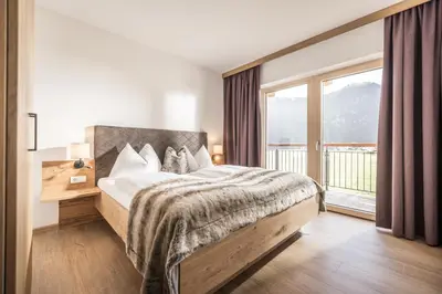 Ein Bett oder Betten in einem Zimmer der Unterkunft Zeit.Glück Appartements