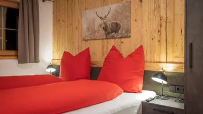 Ein Bett oder Betten in einem Zimmer der Unterkunft Chalet Fasserhäusl im Zillertal - Sauna ,Hot Tub, Kamin, ideal für Familien