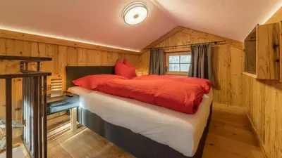Ein Bett oder Betten in einem Zimmer der Unterkunft Chalet Fasserhäusl im Zillertal - Sauna ,Hot Tub, Kamin, ideal für Familien