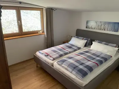 Ein Bett oder Betten in einem Zimmer der Unterkunft Geelink's Berghütte