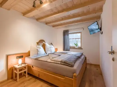 Ein Bett oder Betten in einem Zimmer der Unterkunft Trattenbachhof