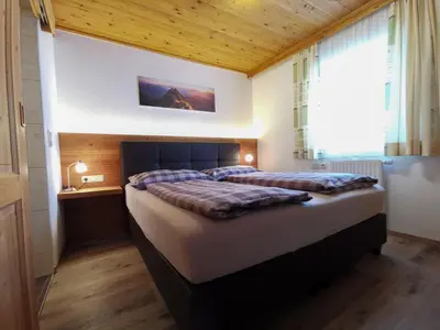 Ein Bett oder Betten in einem Zimmer der Unterkunft Ferienhof Haindlbauer