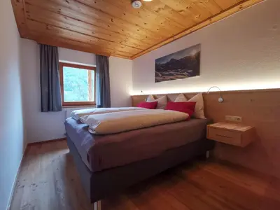 Ein Bett oder Betten in einem Zimmer der Unterkunft Ferienhof Haindlbauer