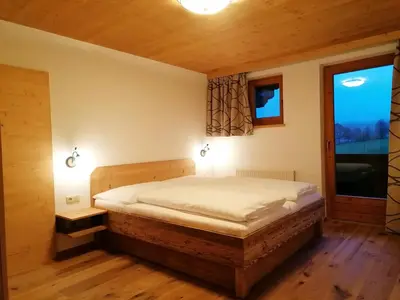 Ein Bett oder Betten in einem Zimmer der Unterkunft Landhaus Brixental