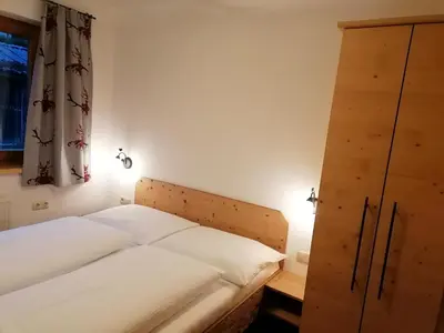 Ein Bett oder Betten in einem Zimmer der Unterkunft Landhaus Brixental