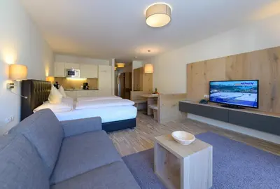 Ein Bett oder Betten in einem Zimmer der Unterkunft Appartementhotel Sonnenhof