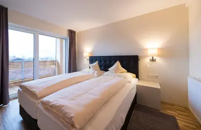 Ein Bett oder Betten in einem Zimmer der Unterkunft Appartementhotel Sonnenhof