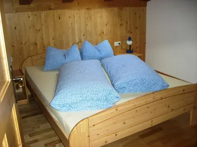Ein Bett oder Betten in einem Zimmer der Unterkunft Vorderstockerhof
