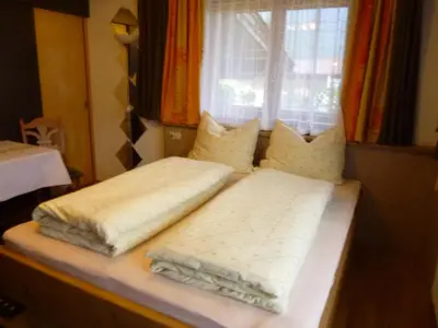 Ein Bett oder Betten in einem Zimmer der Unterkunft Ferienwohnungen Hauser