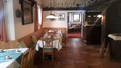 Ein Restaurant oder anderes Speiselokal in der Unterkunft Hirzingerhof