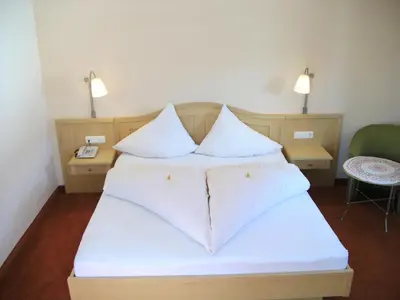 Ein Bett oder Betten in einem Zimmer der Unterkunft Hirzingerhof