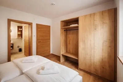Ein Bett oder Betten in einem Zimmer der Unterkunft ISANORA - by AlpenLuxus Collection