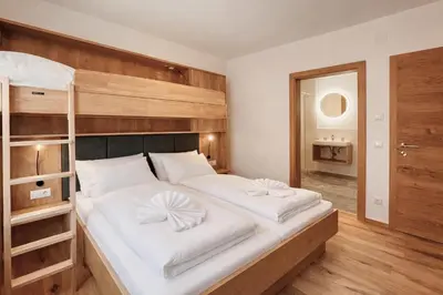 Ein Bett oder Betten in einem Zimmer der Unterkunft ISANORA - by AlpenLuxus Collection