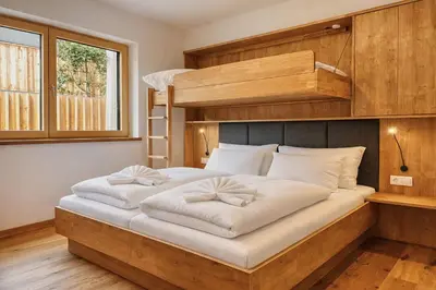Ein Bett oder Betten in einem Zimmer der Unterkunft ISANORA - by AlpenLuxus Collection