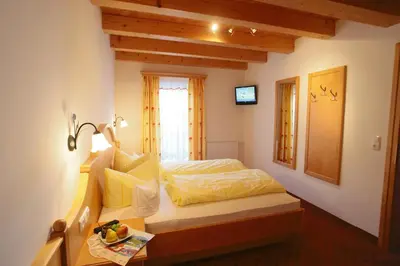 Ein Bett oder Betten in einem Zimmer der Unterkunft Hotel Gasthof Abelhof