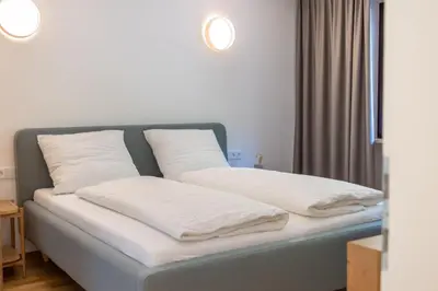 Ein Bett oder Betten in einem Zimmer der Unterkunft Haus Trudi