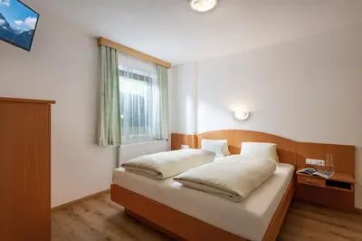 Ein Bett oder Betten in einem Zimmer der Unterkunft Haus Hanser