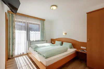 Ein Bett oder Betten in einem Zimmer der Unterkunft Haus Hanser